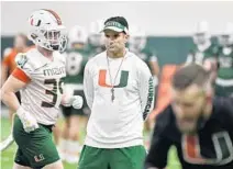  ?? MICHAEL LAUGHLIN/SOUTH FLORIDA SUN SENTINEL ?? UM coach Manny Diaz watches his defense during practice. “Let’s work on our mistakes,” Diaz said as the team prepares for UNC.