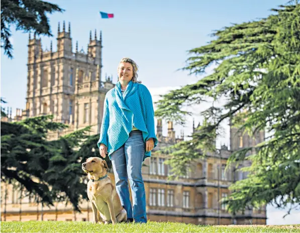  ??  ?? Lady Carnarvon and her dog Alfie in the grounds of Highclere Castle, which was the setting for Downton Abbey. Lady Carnarvon believes reopening the Hampshire estate will be the best way to guarantee employment