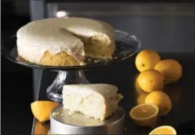  ?? COURTESY PHOTO ?? Meyer lemons are showcased in this lovely buttermilk cake recipe from “Farmer Al” Courchesne of Brentwood’s Frog Hollow Farm. The cake, draped in a Meyer lemon glaze, appears in the new “America the Great Cookbook.”