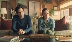  ?? Associated Press ?? Penn Badgley, left, and Victoria Pedretti in a scene from “You,” a series that became a worldwide hit for Netflix after a low-key U.S. start on Lifetime.
