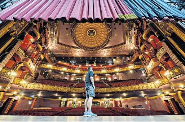  ??  ?? Steve Clarkson, head of facilities at the Palace Theatre in Manchester, inspects the empty auditorium as part of his twice-weekly safety check. The theatre should have been staging David Walliams’ Billionair­e Boy and, later this month, Grease