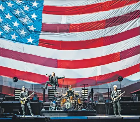  ??  ?? Megaphone diplomacy: U2 on the opening night of their new tour in Tulsa, Oklahoma, above. Left, Bono with Barack Obama in 2006