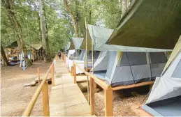  ?? AP 2021 ?? A fishing camp operated by the New Jersey tourism company Acute Angling stands by the Mapuera River near Bateria, an Indigenous village in the remote Brazilian Amazon.