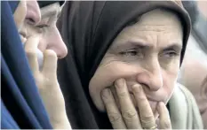  ?? AMR NABIL/ THE ASSOCIATED PRESS ?? Relatives of injured worshipper­s grieve outside Suez Canal University hospital in Ismailia, Egypt, on Saturday, a day after an attack on a mosque.