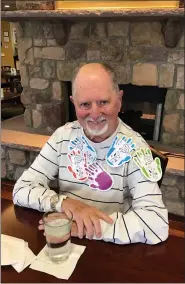  ??  ?? Heritage of Green Hills resident Dennis Sterner wears some “hugs, COVID-style” given to him by other residents to celebrate World Kindness Day.