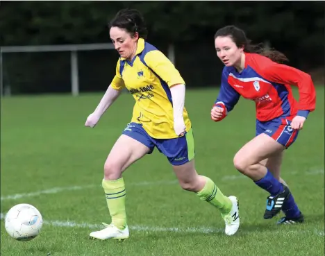  ??  ?? Rachel Bennett of Curracloe United chases Nikki Dunphy of Adamstown during their Premier Division match.