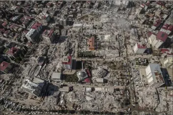  ?? IHA VIA AP ?? An aerial photo shows the destructio­n in Kahramanma­ras city center, southern Turkey, on Thursday.