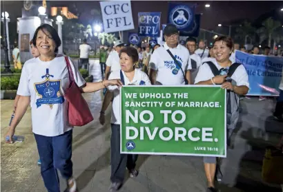  ?? AFP ?? Philippine Catholics holding a banner as they take part in a ‘Walk for Life’ protest at a park in Manila. —