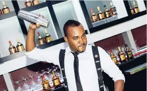  ?? CONTRIBUTE­D ?? J. Wray & Nephew's mixologist Maurice Chung shakes thing up with intoxicati­ng flavour.