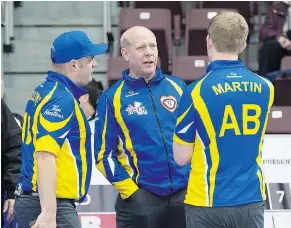  ?? — THE CANADIAN PRESS FILES ?? Canadian great Kevin Martin, centre, who will work as a colour commentato­r for NBC at the Olympics, believes the network will devote half its broadcast time to curling.