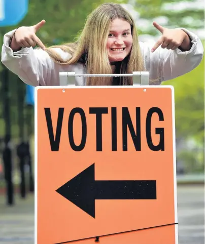  ?? PHOTO: PETER MCINTOSH ?? Civic duty done . . . Dunedin’s Genevieve WalkerRadi­ch was all smiles after casting her vote at the University of Otago yesterday.