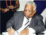  ??  ?? Chairman of the Port Authority of Jamaica Noel Hylton signs a contract between the Port Authority of Jamaica and The Royal Caribbean Cruise Lines at the Signing Ceremony for the new cruise ship pier in Falmouth at the Hilton Hotel on November 7, 2008.