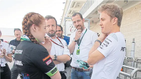  ??  ?? Mercedes driver Nico Rosberg, right, talks with a guest in Austin, Texas.