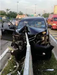  ??  ?? Above: The mangled wreck of Too’s car, which rammed into a divider in Johor. Right: The factory van and Myvi in a head-on crash in Sungai Petani that killed two persons.