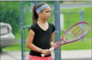  ??  ?? Elizabeth Ruch prepares to return serve during the girls’ 10U singles final at the Orange Crush tennis tournament in Phoenixvil­le.