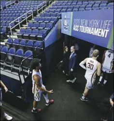  ?? Associated Press ?? NO GAMES Florida State players leave the court after the NCAA basketball games were canceled at the Atlantic Coast Conference tournament in Greensboro, N.C., in this March 12 file photo.