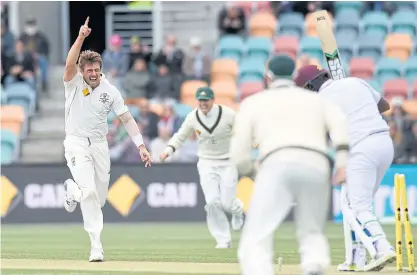  ??  ?? Australia’s James Pattinson, left, celebrates after bowling the West Indies’ Darren Bravo.