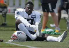 ?? STEVEN SENNE - THE ASSOCIATED PRESS ?? New England Patriots wide receiver Antonio Brown puts on his shoe during an NFL football practice, Wednesday, Sept. 18, 2019, in Foxborough, Mass.