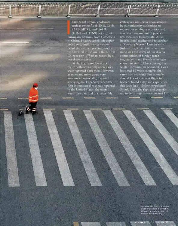  ??  ?? January 30, 2020: A street cleaner crosses a street in Xidan commercial district in downtown Beijing.