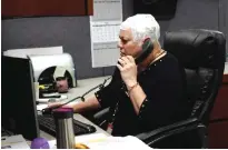  ?? — AP ?? AURORA: In this March 29, 2017 photo, Joyce Endresen wears an Optune therapy device for brain cancer, as she speaks on a phone at work.