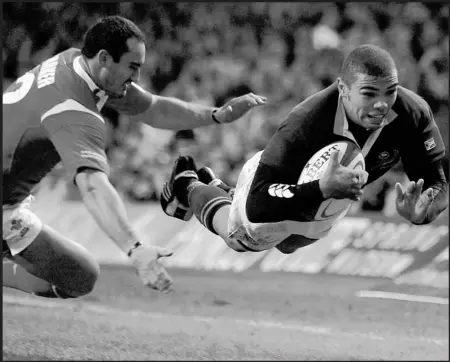  ??  ?? Breaking free... South African wing Bryan Habana flies away from the Wales defence to score one of his two tries