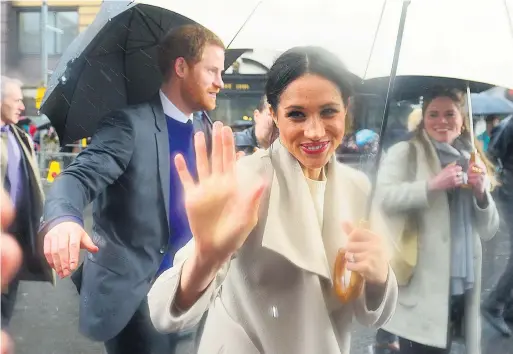  ?? ARTHUR ALLISON ?? All smiles: Prince Harry and Meghan Markle outside Belfast’s Crown Bar during their visit to Northern Ireland in 2018