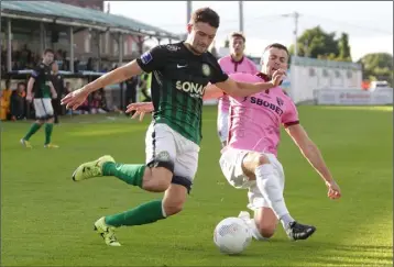  ??  ?? Gareth McDonagh crosses despite the best efforts of left-back Craig McCabe.