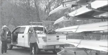  ?? ANN DAVIDSON ?? Coach Gavin Mckay of the Aviron Knowlton Rowing at left is ready to take the trailer load of rowing sculls on the first leg of their journey to Burnaby Lake, BC. Gabrielle Smith on the right is one of the five athletes from AKR competing in the...