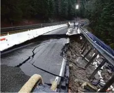  ?? AP ?? Heavy storms over the past two weeks caused parts of the shoulder and one lane of westbound Highway 50 to give way, on Tuesday, near Pollock Pines, California.