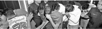  ??  ?? The ten teenagers, aged between 15 and 17, leaving the Magistrate Court yesterday after being charged with rapeing a 13-year-old girl in Taiping.