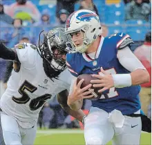  ?? KARL MERTON FERRON BALTIMORE SUN ?? Buffalo Bills quarterbac­k Josh Allen will be at the helm for his team this week after Nathan Peterman’s poor start. Above, Allen is sacked last week during his team’s 47-3 season-opening loss.