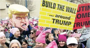  ?? PICTURES: AP ?? DUMP TRUMP: Protesters gather for the Women’s March in Washington during the first full day of Donald Trump’s presidency.