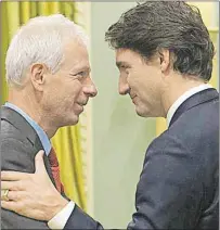  ?? CP FILE PHOTO ?? Newly sworn-in Minister of Foreign Affairs Stephane Dion, left, receives congratula­tions from Prime Minister Justin Trudeau at Rideau Hall in Ottawa in early November.