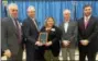  ??  ?? School officials on Friday presented a Business &amp; Industry Award to Camp Echo Lake in Warrensbur­g for its efforts at supporting educationa­l programs in the community. From left are BOCES Chief School Officers Advisory Committee co-Chair Douglas Huntley of Queensbury, Warrensbur­g school Superinten­dent John Goralski, Camp Echo Lake co-owner Laurie Rinke, Warrensbur­g school board President Doug West and BOCES Chief School Officers Advisory Committee co-Chair Adnrew Cook of Hartford.