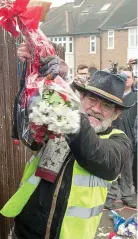  ??  ?? Fury: Mr Gordon grabs flowers