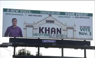  ?? NEWS-SENTINEL PHOTOGRAPH­S BY BEA AHBECK ?? A billboard for Lodi City Council candidate Shakir Khan is seen along the North Highway 99 Frontage Road in Lodi on Wednesday. Khan, running to represent Lodi’s District 4, has been arrested on suspicion of money laundering, conspiracy and illegal gambling.
