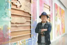  ?? Courtesy of Arario Gallery ?? Artist and collector Ci Kim stands next to his work “Untitled” at Arario Gallery Cheonan.