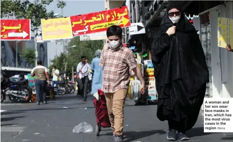  ?? Wana ?? A woman and her son wear face masks in Iran, which has the most virus cases in the region