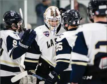  ?? JAMES BEAVER/FOR MEDIANEWS GROUP ?? The LaSalle Explorers celebrate their 8-1victory over Roman Catholic Thursday night in the opening round of the Flyers Cup.