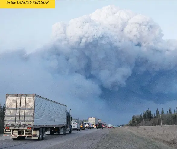  ?? SCOTT OLSON / GETTY IMAGES ?? Drivers wait outside of Fort McMurray, Alta., for clearance to take firefighti­ng supplies into town this week.