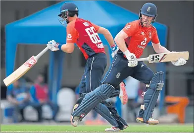  ??  ?? Eoin Morgan and Joe Root run between the wickets during Friday’s tour match against a Sri Lanka Board XI at P Sara Oval