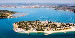  ??  ?? RIGHT Aerial view of the Sandbanks Peninsula and Poole harbour beyond