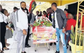  ?? RUDDY MATHISON ?? Pallbearer­s carrying the coffin which bears the remains of Amael Clark at Windsor Road Valley Christian Ministries in Spanish Town, St Catherine, on Saturday.