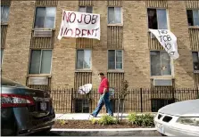  ?? AP Photo/Andrew Harnik ?? Signs that state “No Job No Rent” hang from the windows of an apartment building May 20 in Northwest Washington. The pandemic has shut housing courts and prompted authoritie­s around the U.S. to initiate policies protecting renters from eviction. But not everyone is covered, and some landlords are turning to threats and harassment to force tenants out.