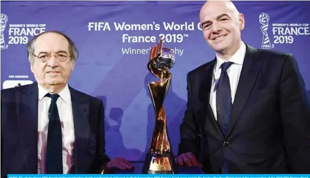  ??  ?? PARIS: File photo shows FIFA President Gianni Infantino (right) and President of French football Associatio­n (FFF) Noel Le Graet, pose next to the trophy after the official start of the organizati­on of the 2019 FIFA Women World Cup in France on Sept 19, 2017, in Paris.