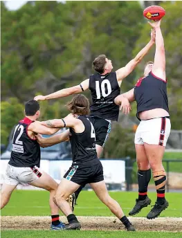  ?? ?? Warragul’s Sam Whibley (right) wins a hit out against Wonthaggi’s Toma Huther. Whibley was named as the Gulls’ best player on a tough day.