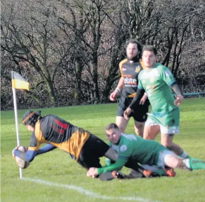  ??  ?? Wing Rhys Fisher scoring a try