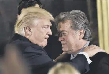  ??  ?? 0 Donald Trump with Stephen Bannon during the swearing-in of senior staff on 22 January, 2017