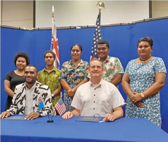  ?? Photo: Shalveen Chand ?? Front From left: Civil Leaders for Clean Transactio­ns (CLCT) Integrity Fiji board chairman Jofiliti Saubuli, US Charge d’Affaires, Tony Greubel. Back from left: Youths for Integrity Fiji, Maria Yavala, Peni Qalo, Frances Vave, Samu Walosio and Senior Administra­tion Officer, Rusula Adikoila Cavalevu after the signing of the grant on April 7, 2021.