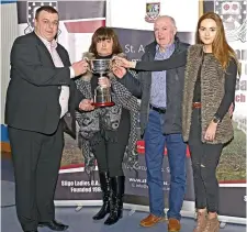  ??  ?? Keith Gilroy Chairman of Sligo Ladies is presented with the Lisa Niland Memorial Perpetual Cup by the Niland Family; Angela, Gerry and Amy Niland. Pics: Tom Callanan.